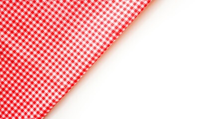 Pink plaid fabric or tablecloth on white background with copy space. 