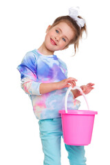 Lovely little girl standing with bucket