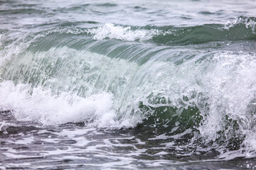 Wave in the sea with splashing water.