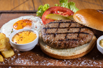 Tasty grilled burger with ingredients. Delicious burger