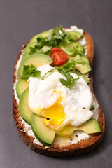 bread slice with avocado and poached egg