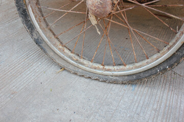 Fototapeta na wymiar Close up of rust on motorcycle wheel. motorcycle tire leak . The condition of the tire has expired.