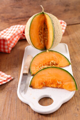 fresh juicy melon slice on board