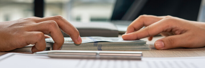 Business woman or accounting officer Presenting and accepting Bribe Cash from Partners in...