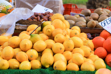 Naklejka na ściany i meble Lemons for sale at a market stall