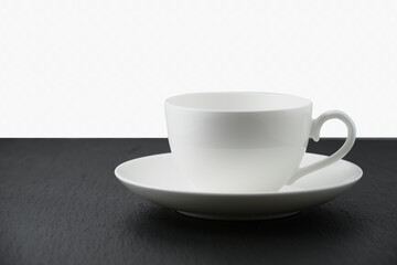 White empty cup on black table