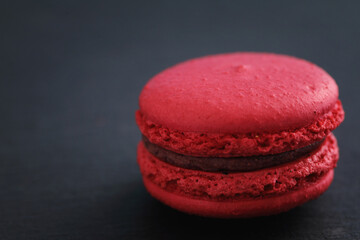 Colorful macarons isolated in black background