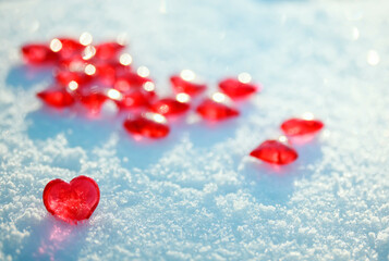 valentine's day greeting card with festive background with transparent red love symbols hearts in the snow