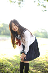 Asian school girl with countryside background