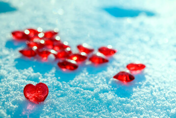 valentine's day greeting card with festive background with transparent red love symbols hearts on blue snow