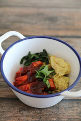 Shrimp dumpling with roasted pork on wood background