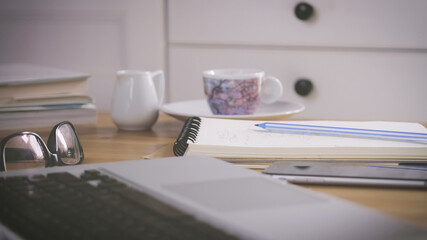 working at home, study at home, smart working. notebook, laptop and smartphone are on desk. communicate and work or study