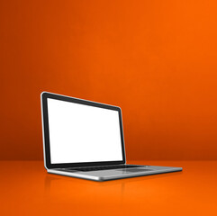 Laptop computer on orange office scene background