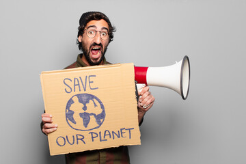 young bearded man protesting with a megaphone