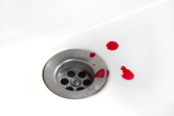 Drops of blood in a sink