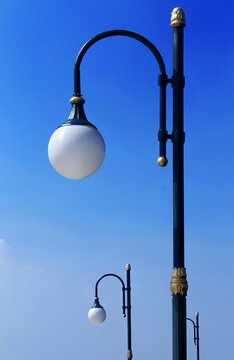 The street lights are lined with blue gradient clouds.