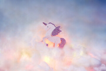 A Winged unicorn or an Alicorn on the clouds. In a surreal concept. © Pum April