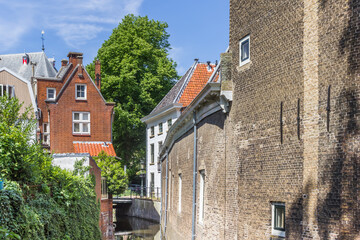 Fototapeta na wymiar Little canal and old houses in Gouda, Netherlands