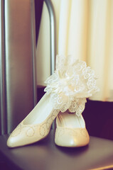 White wedding shoes and garter belt