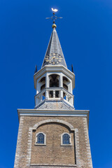 Fototapeta na wymiar Historic tower Vrouwentoren in the center of Gouda, Netherlands