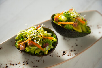 Avocado stuffed with salad. Super food vegan recipe.