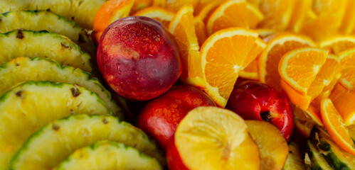 Assorted fresh sliced fruit nectarine pineapple orange