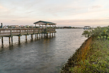 Fototapeta na wymiar Fishing Pier at Flageler Florida along the Intercoastal waterway