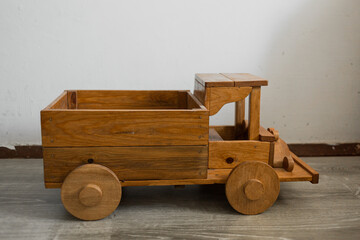 Wooden toy car in rustic style.