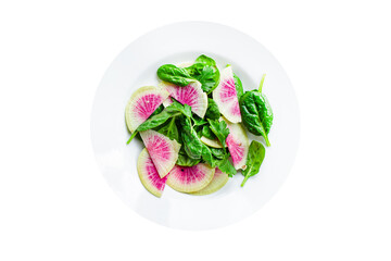 Watermelon radish salad chinese daikon diet vegan Slices pink fruit vegetables, green leaves spinach lettuce vegetarian meal snack top view copy space food background rustic keto or paleo diet
