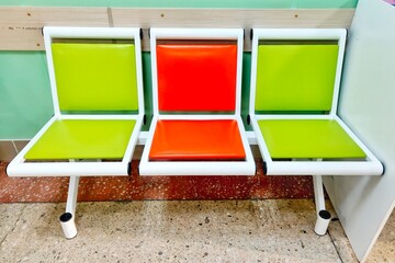 bright colored chairs in the hospital corridor.