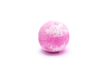 Aroma pink bubbling round bright bath bomb isolated on a white background. Close-up of bath salts