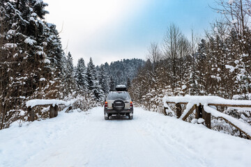 Off Road Adventure in Winter Snow Covered Wilderness Forest. 4x4 Icy Road Driving © marcin jucha