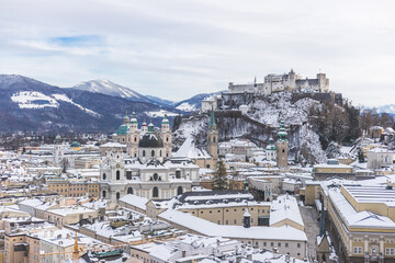 Fototapeta premium Panorama of Salzburg in winter: Snowy historical center and old city