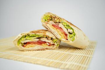 Homemade shawarma / burrito / pita / chicken roll with vegetables and sauce.