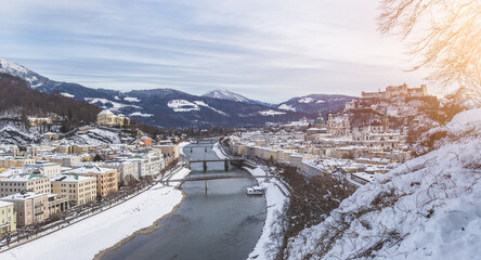 Panorama of Salzburg in winter: Snowy historical center and old city, sunshine