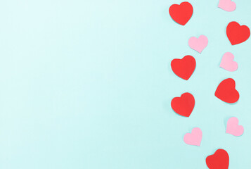 Red and pink heart switch on blue background. Valentine's Day Concept.