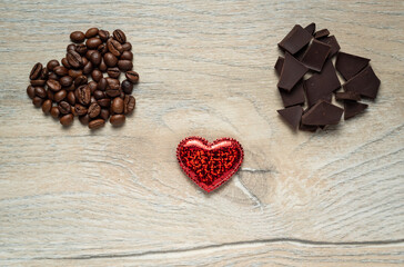Valentine's day gift card made from chocolate and roasted coffee beans on an Oak like wooden background.