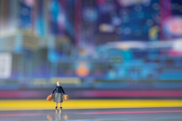 Miniature people : The tourists stand behind the scene of the technology city