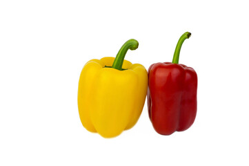 Yellow and red sweet pepper with leaves isolated on a white background