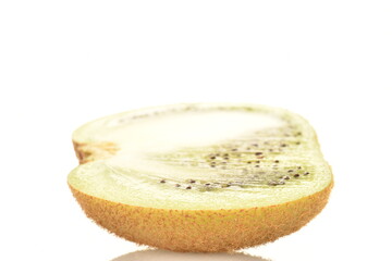 One half of a natural organic kiwi, close up, isolated on white.