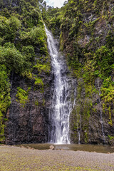 Obraz premium Idyllic Tropical Waterfall on the island of Tahiti, French Polynesia. Pacific Ocean.