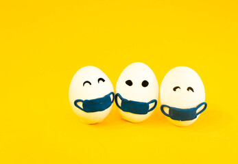 Chicken eggs in medical masks on the face. The concept of the Easter 2021 holiday in relation to...