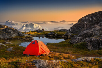 sitting, relax by the sea with icebergs in the fog, in the haze