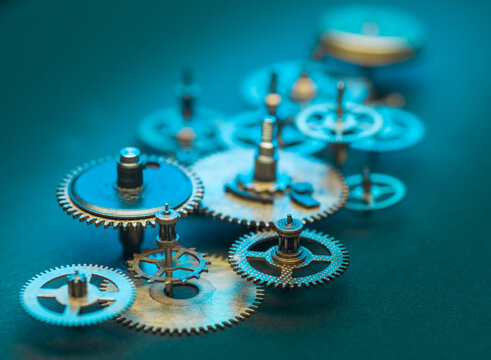 Close up of Steampunk Clock Cogs on blue background