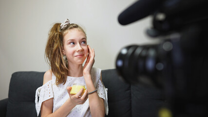 Teenage girl making video blog about skincare. Vlog concept.