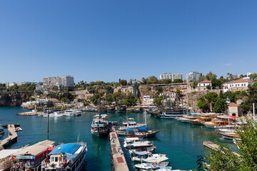 Fototapeta na wymiar View to the city port, boats and empty blue sky