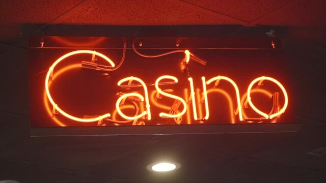 Bright Casino Neon Sign Hangs from the ceiling