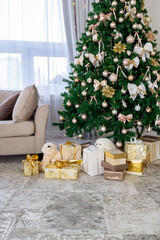 Luxury rich expensive apartment interior in light colors. Stylish contemporary minimalistic design. Full of sun light. A lot of space decorated with Christmas tree