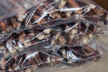 Packs of the dried bovine penis for pets.