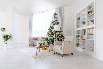 Luxury rich expensive apartment interior in light colors. Stylish contemporary minimalistic design. Full of sun light. A lot of space decorated with Christmas tree